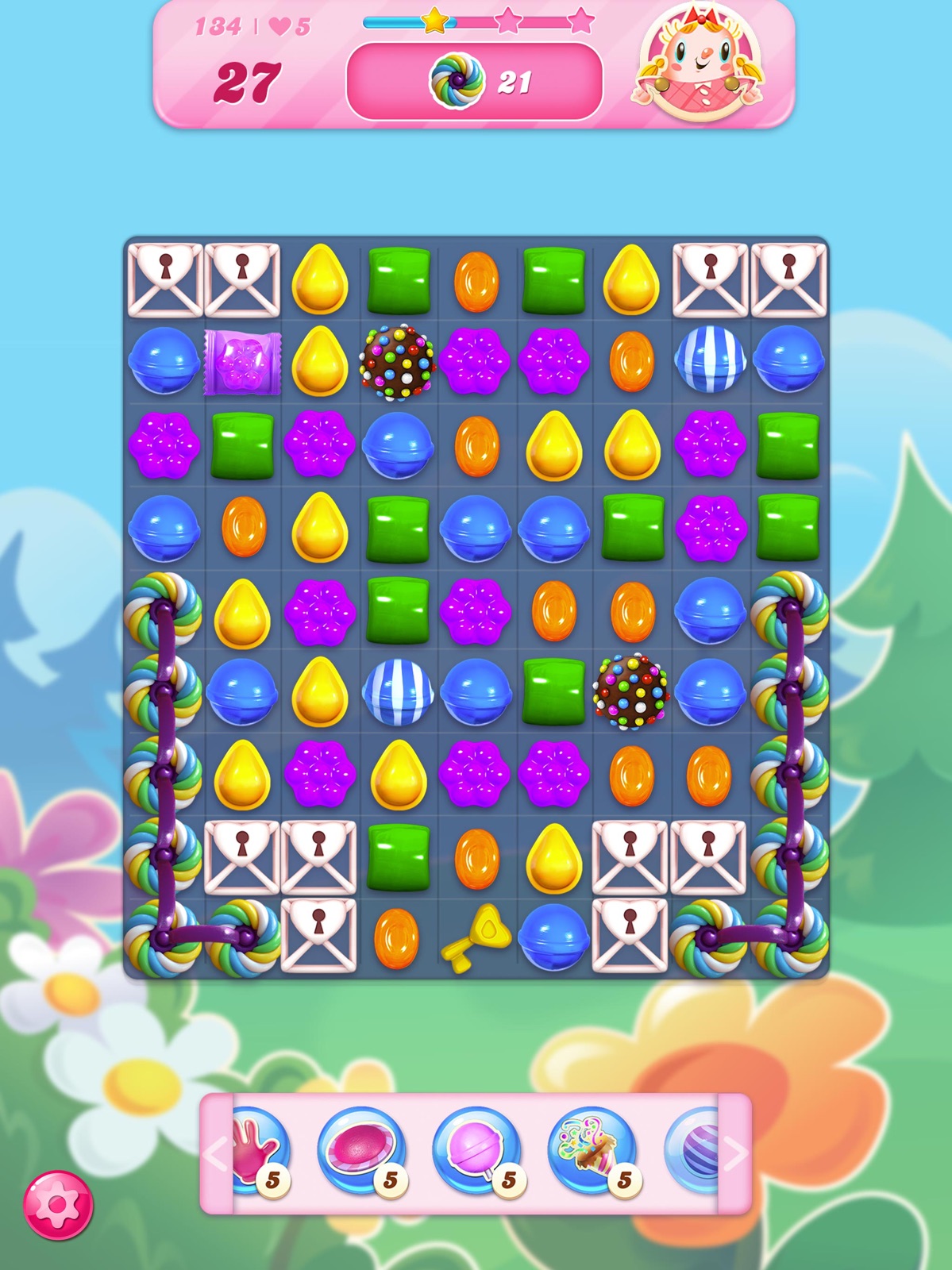 Official Candy Crush Saga gameplay board showing distinct candy shapes, colors, blockers, and special pieces